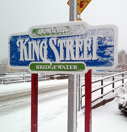 A snow covered street sign that reads, "King Street, Bridgewater".