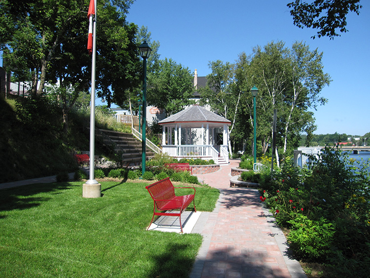 Gazebo and walking path in a landscaped park along the LaHave River in Bridgewater